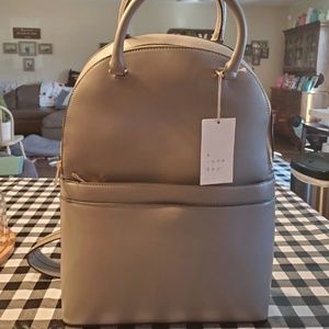 A new day backpack purse